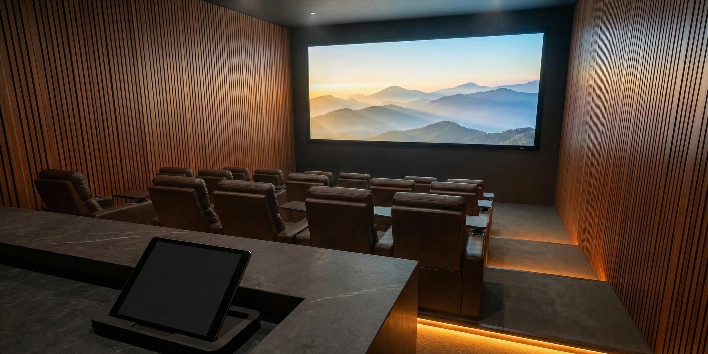 Private home theater with tiered leather seating and large screen