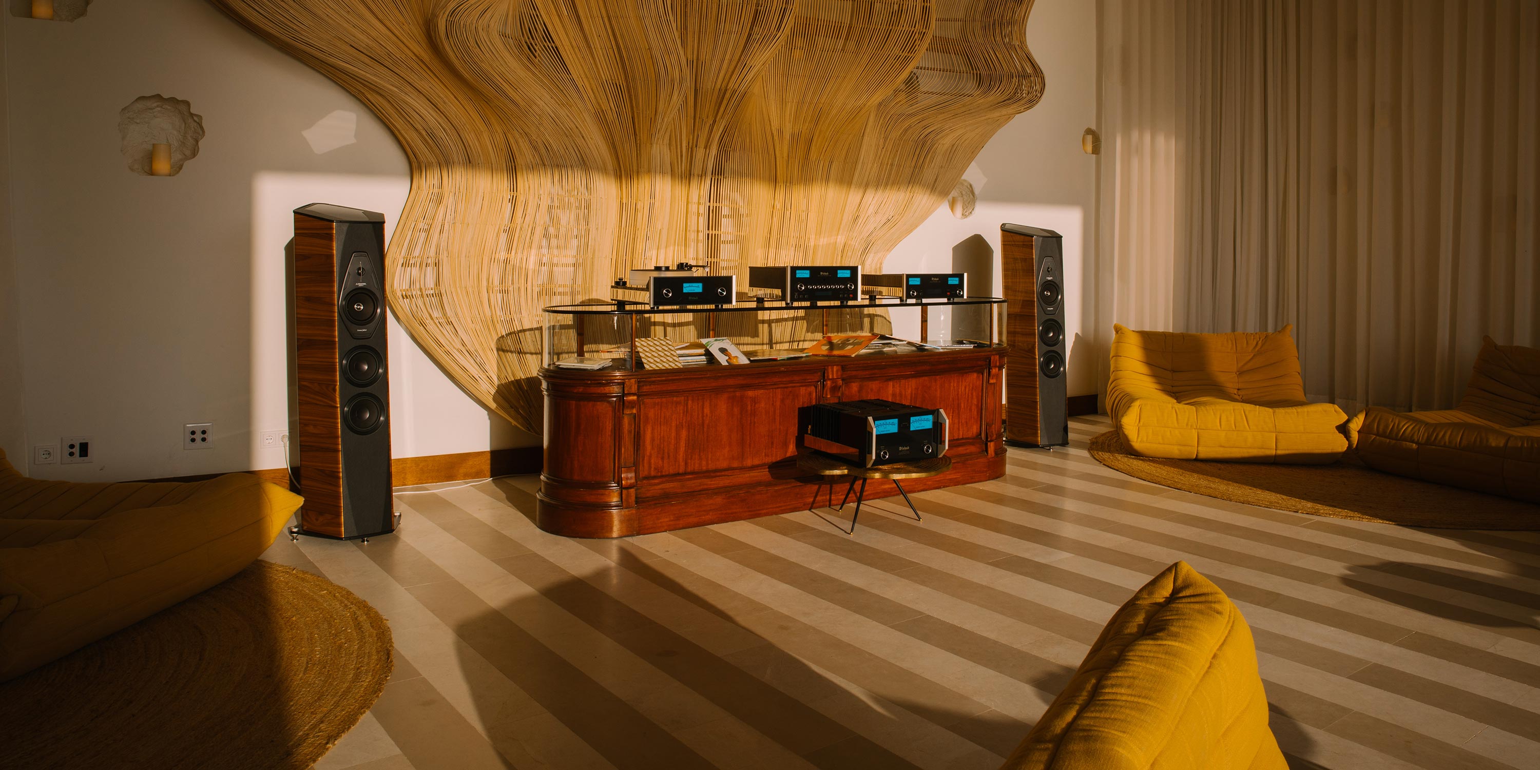 Cozy room with audio equipment, speakers, and yellow lounge chairs